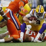 LSU quarterback Joe Burrow is sacked by Clemson defensive end Justin Foster during the first half of a NCAA College Football Playoff national championship game Monday, Jan. 13, 2020, in New Orleans. (AP Photo/Gerald Herbert)
