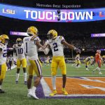 LSU wide receiver Ja'Marr Chase (1) celebrates after scoring with wide receiver Justin Jefferson during the first half of a NCAA College Football Playoff national championship game against Clemson Monday, Jan. 13, 2020, in New Orleans. (AP Photo/Gerald Herbert)