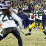 Green Bay Packers' Aaron Rodgers scrambles during the first half of an NFL divisional playoff football game against the Seattle Seahawks Sunday, Jan. 12, 2020, in Green Bay, Wis. (AP Photo/Matt Ludtke)