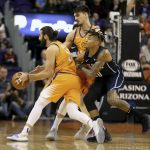Orlando Magic's Markelle Fultz, front right, collides with Phoenix Suns' Dario Saric, back right, as Suns' Ricky Rubio (11) dribbles around the pick during the first half of an NBA basketball game Friday, Jan. 10, 2020, in Phoenix. (AP Photo/Darryl Webb)