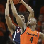 Arizona's Zeke Nnaji, left, battles Oregon State's Alfred Hollins for a rebound during the first half of an NCAA college basketball game in Corvallis, Ore., Sunday, Jan. 12, 2020. (AP Photo/Chris Pietsch)