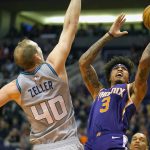 Phoenix Suns forward Kelly Oubre Jr. (3) shoots over Charlotte Hornets forward Cody Zeller during the second half of an NBA basketball game Sunday, Jan. 12, 2020, in Phoenix. Phoenix won 100-92. (AP Photo/Rick Scuteri)
