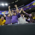 Fans celebrates after LSU wide receiver Ja'Marr Chase scored against Clemson during the first half of a NCAA College Football Playoff national championship game Monday, Jan. 13, 2020, in New Orleans. (AP Photo/Gerald Herbert)