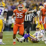 LSU quarterback Joe Burrow is sacked by Clemson defensive end Justin Foster during the first half of a NCAA College Football Playoff national championship game Monday, Jan. 13, 2020, in New Orleans.(AP Photo/David J. Phillip)