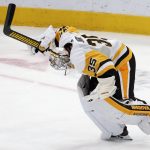 Pittsburgh Penguins goaltender Tristan Jarry celebrates his final save against the Arizona Coyotes during the shootout of an NHL hockey game Sunday, Jan. 12, 2020, in Glendale, Ariz. The Penguins defeated the Coyotes 4-3. (AP Photo/Ross D. Franklin)
