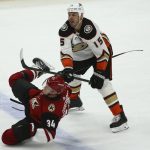 Anaheim Ducks center Ryan Getzlaf (15) checks Arizona Coyotes center Carl Soderberg (34) to the ice during the second period of an NHL hockey game Thursday, Jan. 2, 2020, in Glendale, Ariz. (AP Photo/Ross D. Franklin)