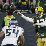 Green Bay Packers' Aaron Rodgers throws during the second half of an NFL divisional playoff football game against the Seattle Seahawks Sunday, Jan. 12, 2020, in Green Bay, Wis. (AP Photo/Mike Roemer)