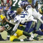 Seattle Seahawks' Shaquem Griffin and Shaquill Griffin sack Green Bay Packers quarterback Aaron Rodgers during the second half of an NFL divisional playoff football game Sunday, Jan. 12, 2020, in Green Bay, Wis. (AP Photo/Mike Roemer)
