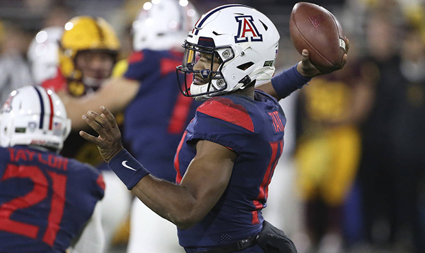 Arizona's Khalil Tate (14) looks to pass against Arizona State's defense during the first half of a...