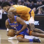 Oklahoma City Thunder guard Chris Paul (3) dives for a loose ball, beating Phoenix Suns forward Kelly Oubre Jr. (3) to it during the second half of an NBA basketball game Friday, Jan. 31, 2020, in Phoenix. The Thunder won 111-107. (AP Photo/Ross D. Franklin)
