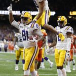 LSU tight end Thaddeus Moss celebrates after scoring during the first half of a NCAA College Football Playoff national championship game against Clemson, Monday, Jan. 13, 2020, in New Orleans. (AP Photo/Gerald Herbert)