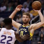 Indiana Pacers forward Domantas Sabonis (11) looks to pass over Phoenix Suns center Deandre Ayton (22) during the first half of an NBA basketball game, Wednesday, Jan. 22, 2020, in Phoenix. (AP Photo/Matt York)