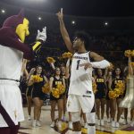 Arizona State guard Remy Martin (1) celebrates with mascot Sparky, cheerleaders and fans after an NCAA college basketball game win against Arizona Saturday, Jan. 25, 2020, in Tempe, Ariz. Arizona State defeated Arizona 66-65. (AP Photo/Ross D. Franklin)