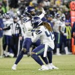 Seattle Seahawks' Shaquill Griffin and Shaquem Griffin celebrate a sack during the second half of an NFL divisional playoff football game against the Green Bay Packers Sunday, Jan. 12, 2020, in Green Bay, Wis. (AP Photo/Mike Roemer)