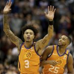Phoenix Suns' Kelly Oubre Jr. (3) and Mikal Bridges (25) celebrate after coming back late in an NBA basketball game against the Orlando Magic during the second half Friday, Jan. 10, 2020, in Phoenix. (AP Photo/Darryl Webb)