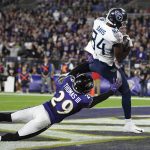 Tennessee Titans wide receiver Corey Davis (84) makes a touchdown catch against Baltimore Ravens free safety Earl Thomas (29) during the second half an NFL divisional playoff football game, Saturday, Jan. 11, 2020, in Baltimore. (AP Photo/Nick Wass)