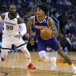 Phoenix Suns forward Kelly Oubre Jr. (3) drives past Memphis Grizzlies forward Jae Crowder in the second half during an NBA basketball game, Sunday, Jan. 5, 2020, in Phoenix. The Grizzlies won 121-114. (AP Photo/Rick Scuteri)