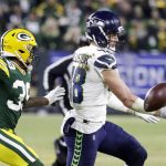 Seattle Seahawks' Jacob Hollister can't catch a pass in front of Green Bay Packers' Chandon Sullivan during the first half of an NFL divisional playoff football game Sunday, Jan. 12, 2020, in Green Bay, Wis. (AP Photo/Darron Cummings)