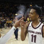 Arizona State guard Alonzo Verge Jr. (11) celebrates a win against Arizona with Arizona State's Andre Allen, left, after an NCAA college basketball game Saturday, Jan. 25, 2020, in Tempe, Ariz. Arizona State defeated Arizona 66-65. (AP Photo/Ross D. Franklin)