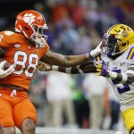 Clemson tight end Braden Galloway, left, is tackled by LSU safety Marcel Brooks during the first half of a NCAA College Football Playoff national championship game Monday, Jan. 13, 2020, in New Orleans. (AP Photo/Gerald Herbert)