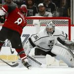 Arizona Coyotes center Nick Schmaltz (8) shoots the puck wide of the net against Los Angeles Kings goaltender Jack Campbell (36) during the first period of an NHL hockey game Thursday, Jan. 30, 2020, in Glendale, Ariz. (AP Photo/Ross D. Franklin)