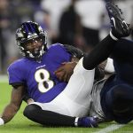 Baltimore Ravens quarterback Lamar Jackson (8) is sacked by Tennessee Titans outside linebacker Kamalei Correa (44) during the first half an NFL divisional playoff football game, Saturday, Jan. 11, 2020, in Baltimore. (AP Photo/Nick Wass)
