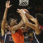 Oregon State's Alfred Hollins, center, goes up for a shot between Arizona's Zeke Nnaji, left, and Josh Green during the second half of an NCAA college basketball game in Corvallis, Ore., Sunday, Jan. 12, 2020. (AP Photo/Chris Pietsch)