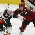 Arizona Coyotes defenseman Jakob Chychrun (6) gives Anaheim Ducks right wing Ondrej Kase (25) a shove during the second period of an NHL hockey game Thursday, Jan. 2, 2020, in Glendale, Ariz. (AP Photo/Ross D. Franklin)