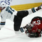 San Jose Sharks right wing Stefan Noesen (11) flips over Arizona Coyotes defenseman Jason Demers (55) during the third period of an NHL hockey game Tuesday, Jan. 14, 2020, in Glendale, Ariz. The Coyotes defeated the Sharks 6-3. (AP Photo/Ross D. Franklin)