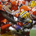 LSU wide receiver Justin Jefferson is tackled by Clemson during the first half of a NCAA College Football Playoff national championship game Monday, Jan. 13, 2020, in New Orleans. (AP Photo/Gerald Herbert)