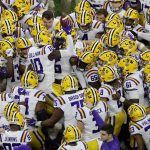 LSU gathers before a NCAA College Football Playoff national championship game against Clemson Monday, Jan. 13, 2020, in New Orleans. (AP Photo/Eric Gay)