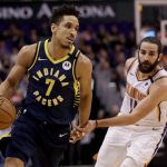 Indiana Pacers guard Malcolm Brogdon (7) drives past Phoenix Suns guard Ricky Rubio (11) during the first half of an NBA basketball game, Wednesday, Jan. 22, 2020, in Phoenix. (AP Photo/Matt York)
