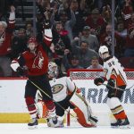 Arizona Coyotes center Carl Soderberg, left, celebrates his goal against Anaheim Ducks goaltender John Gibson, middle, as Ducks defenseman Jacob Larsson (32) looks for the puck during the third period of an NHL hockey game Thursday, Jan. 2, 2020, in Glendale, Ariz. The Coyotes won 4-2. (AP Photo/Ross D. Franklin)