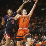 Oregon State's Zach Reichle (11) shoots ahead of Arizona's Jemarl Baker Jr. (10) during the second half of an NCAA college basketball game in Corvallis, Ore., Sunday, Jan. 12, 2020. (AP Photo/Chris Pietsch)