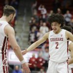 Washington State forward CJ Elleby (2) celebrates his go-ahead basket with forward Jeff Pollard (13) during the second half of the team's NCAA college basketball game against Arizona State in Pullman, Wash., Wednesday, Jan. 29, 2020. (AP Photo/Young Kwak)