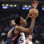 Phoenix Suns forward Mikal Bridges (25) defends as New York Knicks guard Elfrid Payton (6) looks for an opening to take a shot during the first quarter of an NBA basketball game in New York, Thursday, Jan. 16, 2020. (AP Photo/Kathy Willens)