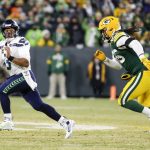 Seattle Seahawks quarterback Russell Wilson scrambles during the first half of an NFL divisional playoff football game against the Green Bay Packers Sunday, Jan. 12, 2020, in Green Bay, Wis. (AP Photo/Matt Ludtke)