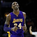 In this Dec. 1, 2015 file photo Los Angeles Lakers' Kobe Bryant smiles as he jogs to the bench during the first half of an NBA basketball game against the Philadelphia 76ers in Philadelphia. The Retired NBA superstar has died in helicopter crash in Southern California, Sunday, Jan. 26, 2020. (AP Photo/Matt Slocum)