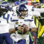 Seattle Seahawks quarterback Russell Wilson drops back during the first half of an NFL divisional playoff football game against the Green Bay Packers Sunday, Jan. 12, 2020, in Green Bay, Wis. (AP Photo/Mike Roemer)