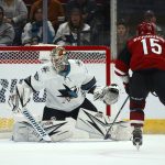 San Jose Sharks goaltender Aaron Dell (30) makes a save on a shot by Arizona Coyotes center Brad Richardson (15) during the first period of an NHL hockey game Tuesday, Jan. 14, 2020, in Glendale, Ariz. (AP Photo/Ross D. Franklin)
