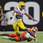 LSU running back Clyde Edwards-Helaire breaks away from Clemson cornerback Derion Kendrick during the second half of a NCAA College Football Playoff national championship game Monday, Jan. 13, 2020, in New Orleans. (AP Photo/Gerald Herbert)
