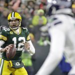 Green Bay Packers' Aaron Rodgers drops back during the first half of an NFL divisional playoff football game against the Seattle Seahawks Sunday, Jan. 12, 2020, in Green Bay, Wis. (AP Photo/Mike Roemer)