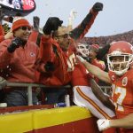 Kansas City Chiefs tight end Travis Kelce (87) celebrates with fans after tight end Blake Bell scored a touchdown against the Houston Texans, during the second half of an NFL divisional playoff football game, in Kansas City, Mo., Sunday, Jan. 12, 2020. (AP Photo/Charlie Riedel)
