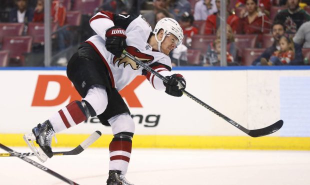 Arizona Coyotes left wing Lawson Crouse shoots during the first period of the team's NHL hockey gam...