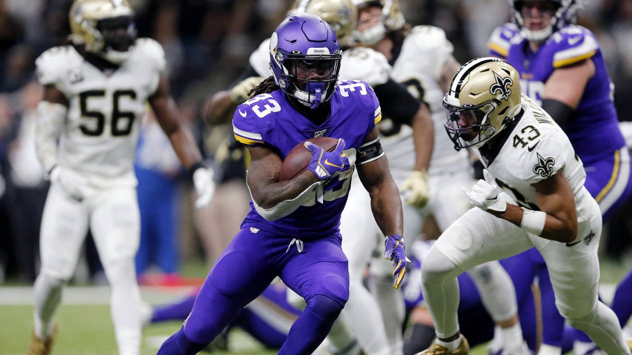 Minnesota Vikings running back Dalvin Cook (33) carries for a touchdown in front of New Orleans Sai...