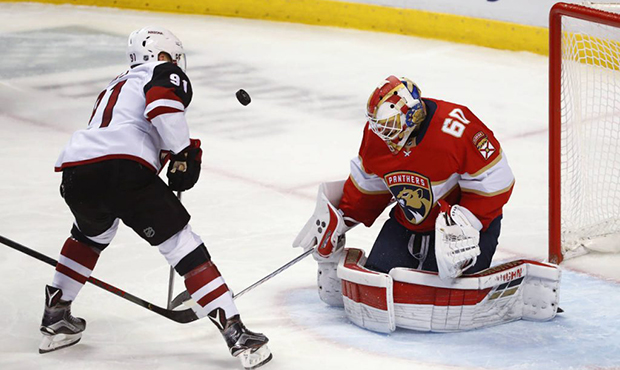 Arizona Coyotes left wing Taylor Hall (91) shoots on Florida Panthers goaltender Chris Driedger (60...