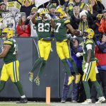 Green Bay Packers' Davante Adams celebrates his touchdown catch with Marquez Valdes-Scantling (83) during the first half of an NFL divisional playoff football game against the Seattle Seahawks Sunday, Jan. 12, 2020, in Green Bay, Wis. (AP Photo/Darron Cummings)