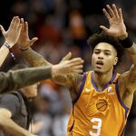 Phoenix Suns' Kelly Oubre Jr. (3) celebrate with fans after coming back late in an NBA basketball game against the Orlando Magic during the second half Friday, Jan. 10, 2020, in Phoenix. (AP Photo/Darryl Webb)
