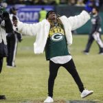 Rapper Lil Wayne sings during a break during the second half of an NFL divisional playoff football game between the Green Bay Packers and the Seattle Seahawks Sunday, Jan. 12, 2020, in Green Bay, Wis. (AP Photo/Matt Ludtke)