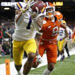 LSU wide receiver Ja'Marr Chase catches a touchdown pass in front of Clemson cornerback A.J. Terrell during the first half of a NCAA College Football Playoff national championship game Monday, Jan. 13, 2020, in New Orleans. (AP Photo/Gerald Herbert)